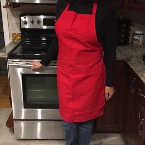 Red Apron by Fame Fabrics with 2 front pockets and adjustable strap, New